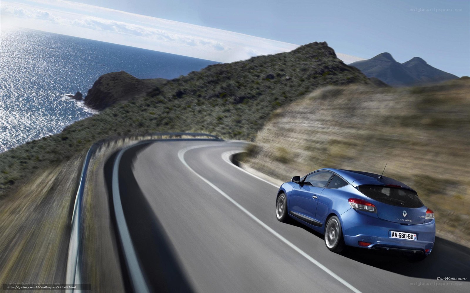 Blue car on coastal road