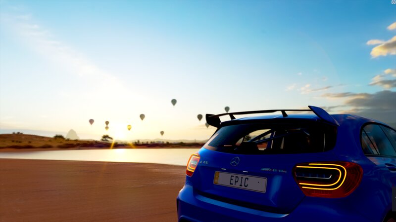 Blue Car on Desert Road — Serene