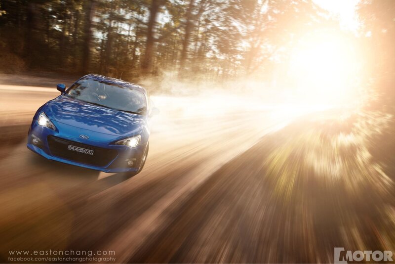 Blue car on dirt road