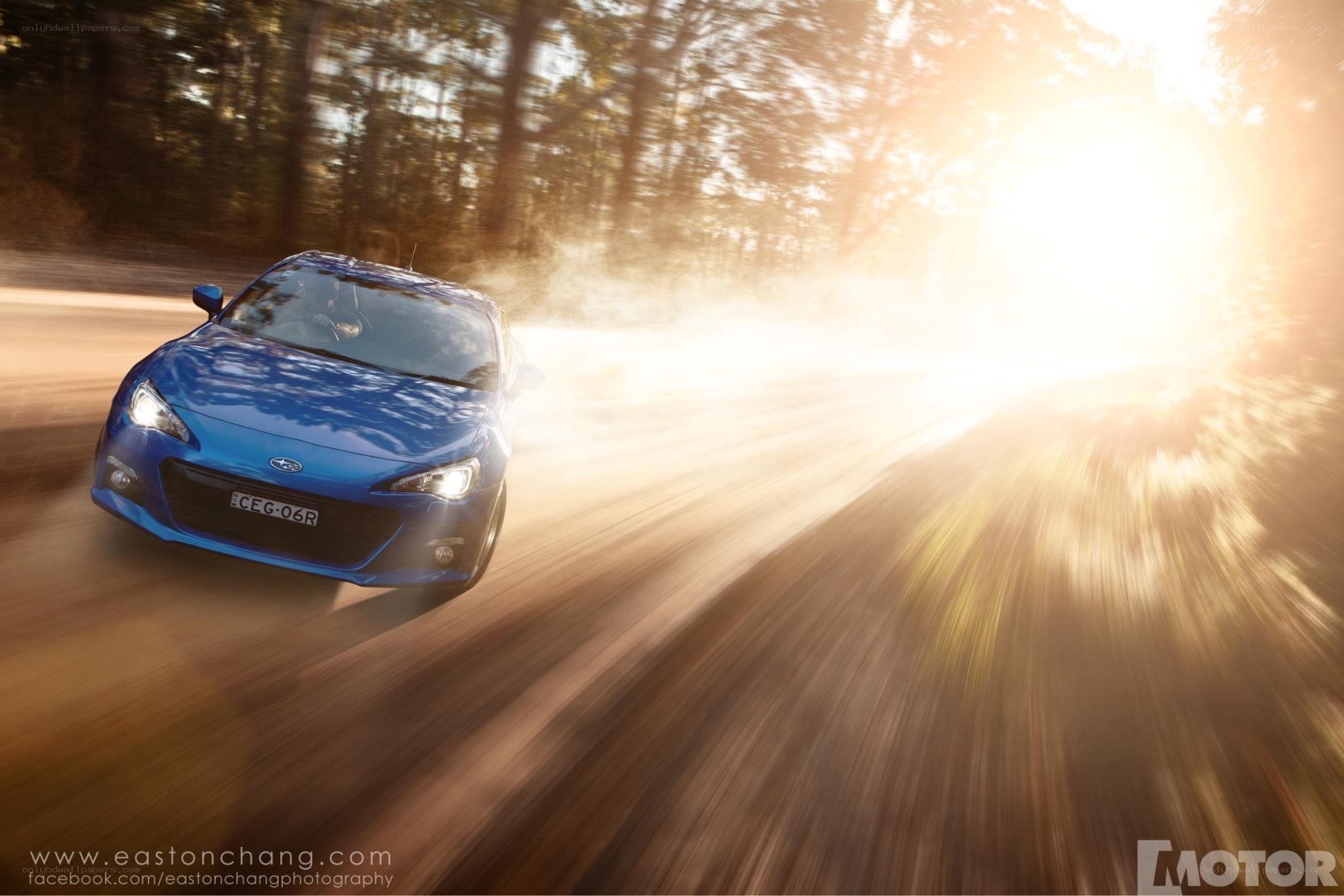 Blue car on dirt road