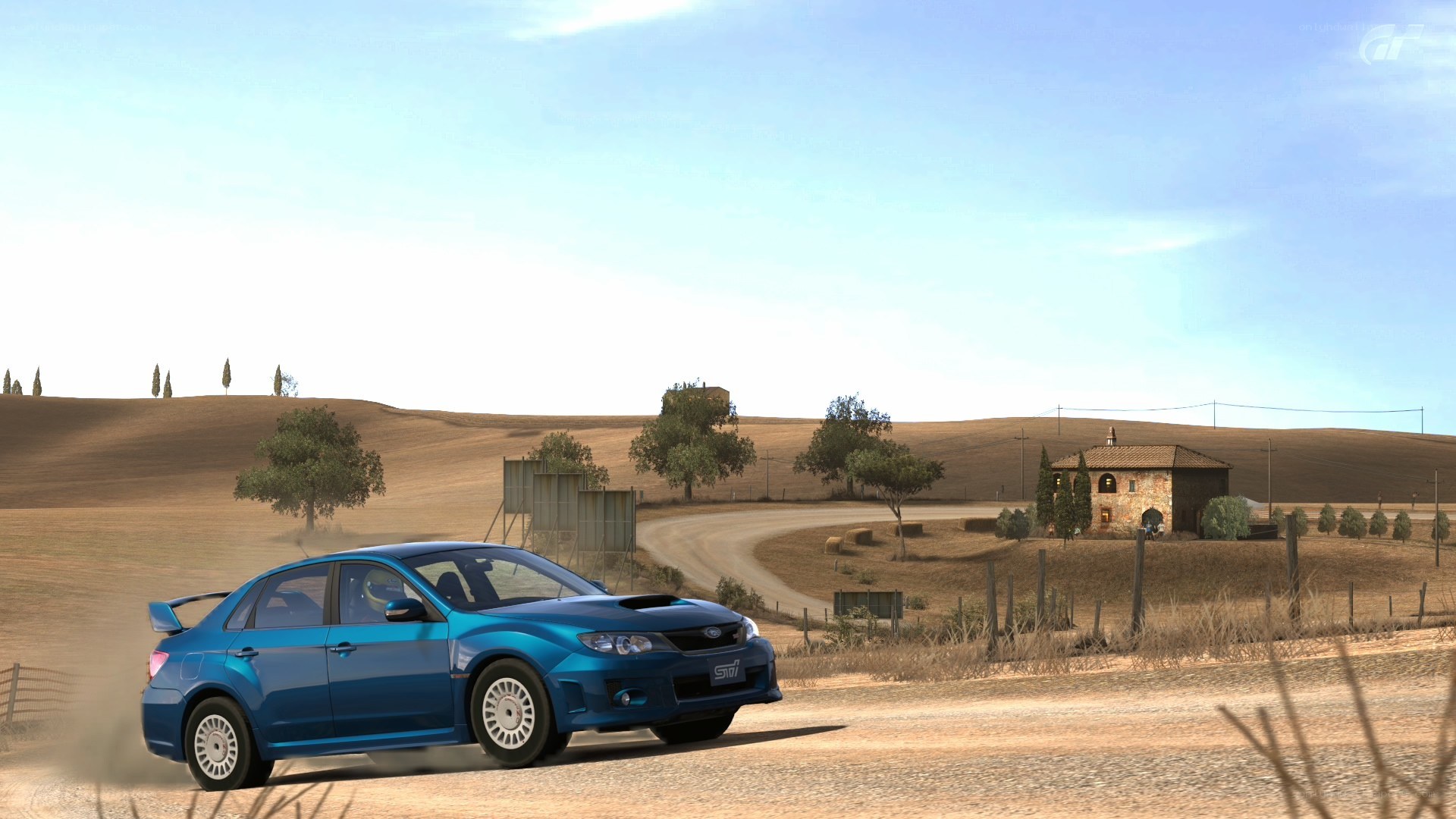 blue car on dirt road