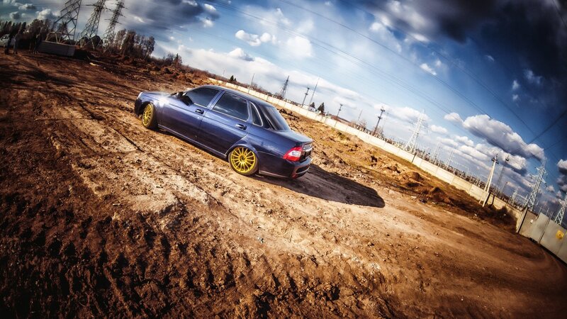 Blue Car on Dirt