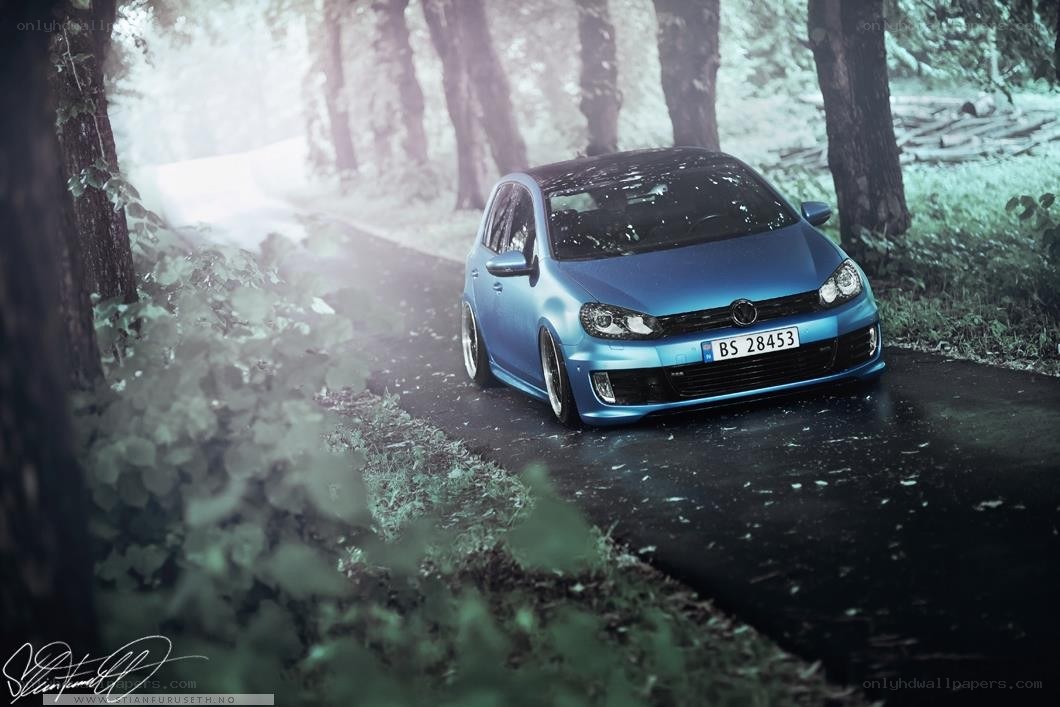 Blue car on forest road