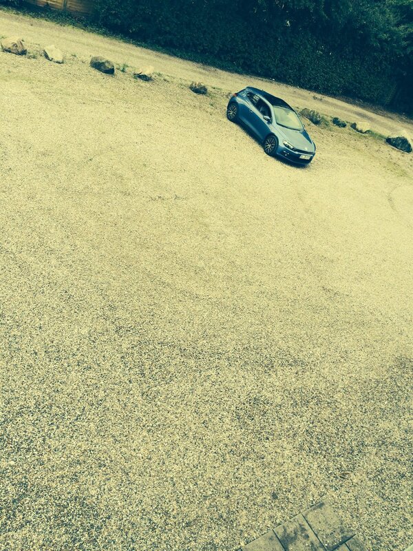 Blue Car on Gravel