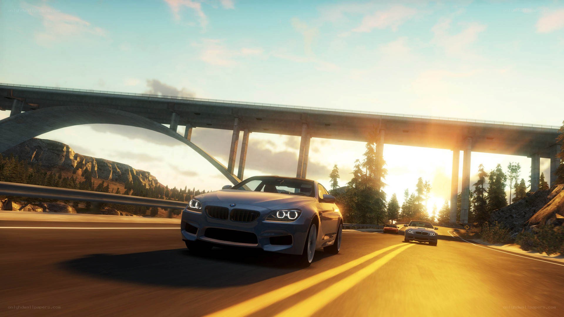 Blue car on highway at sunset