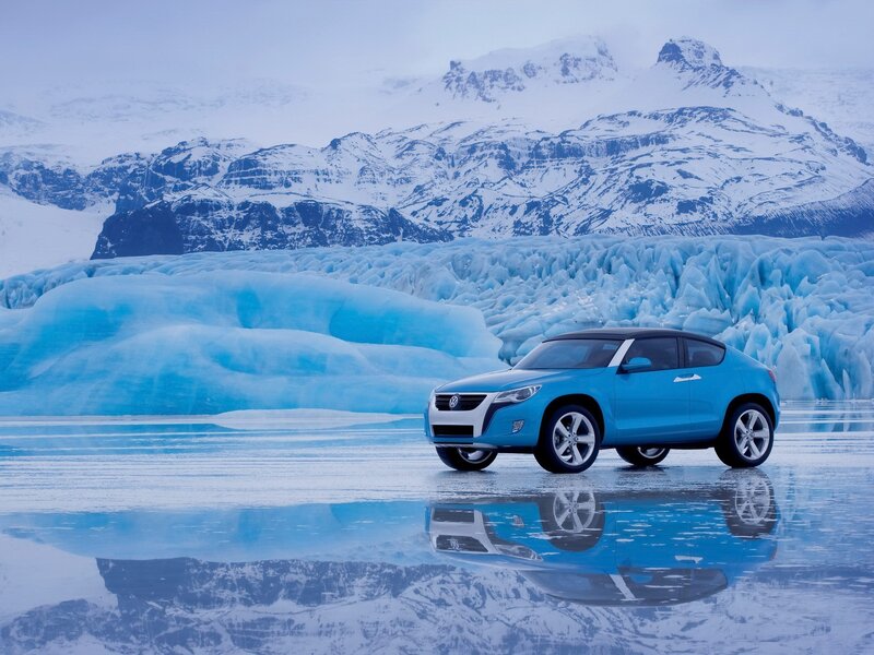 Blue car on icy landscape