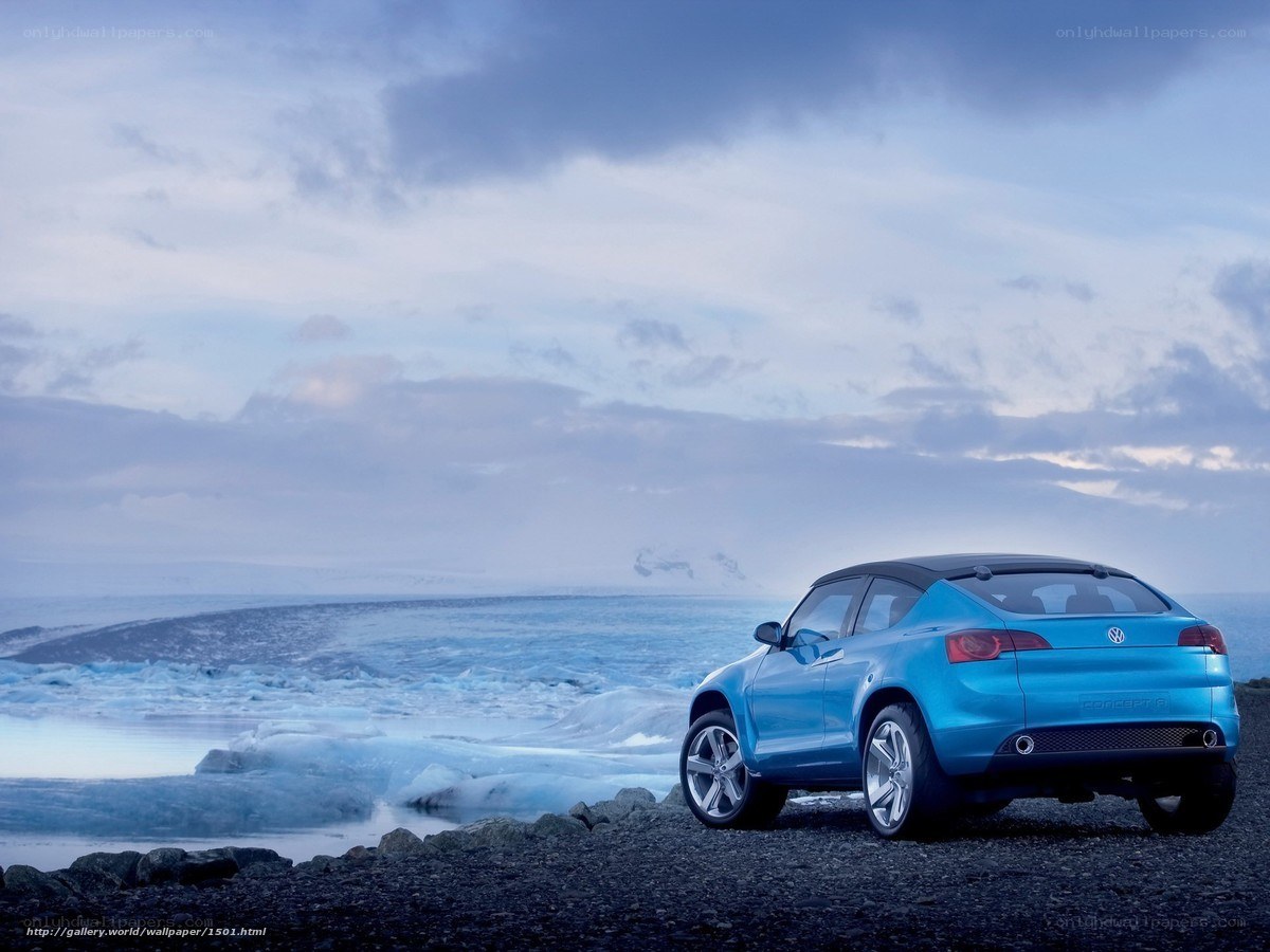 Blue car on icy shore