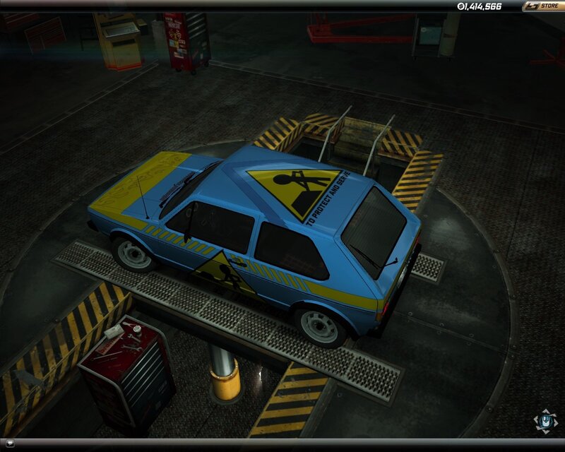blue car on lift in garage