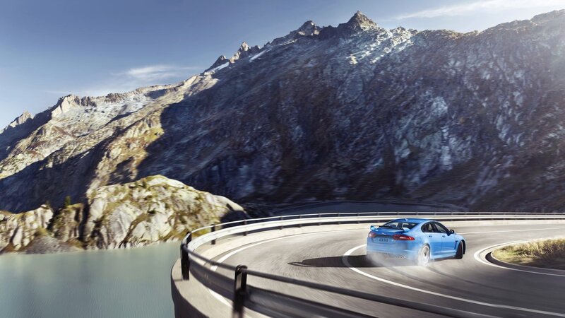 Blue Car on Mountain Road — Dramatic