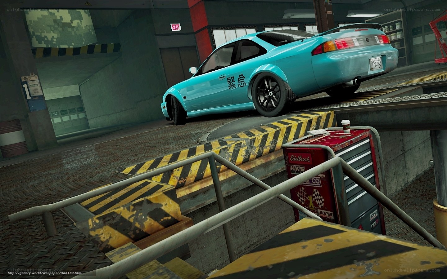 blue car on ramp in garage