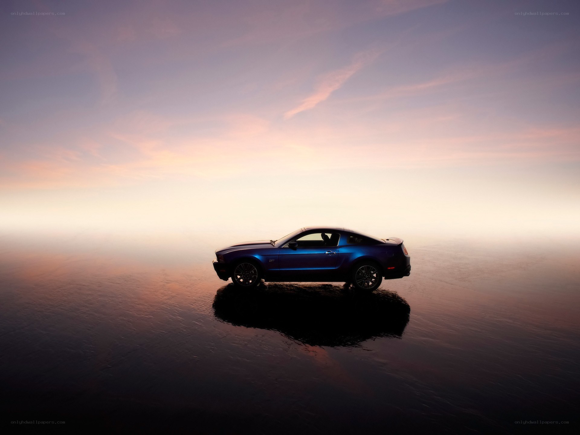 Blue car on reflective surface