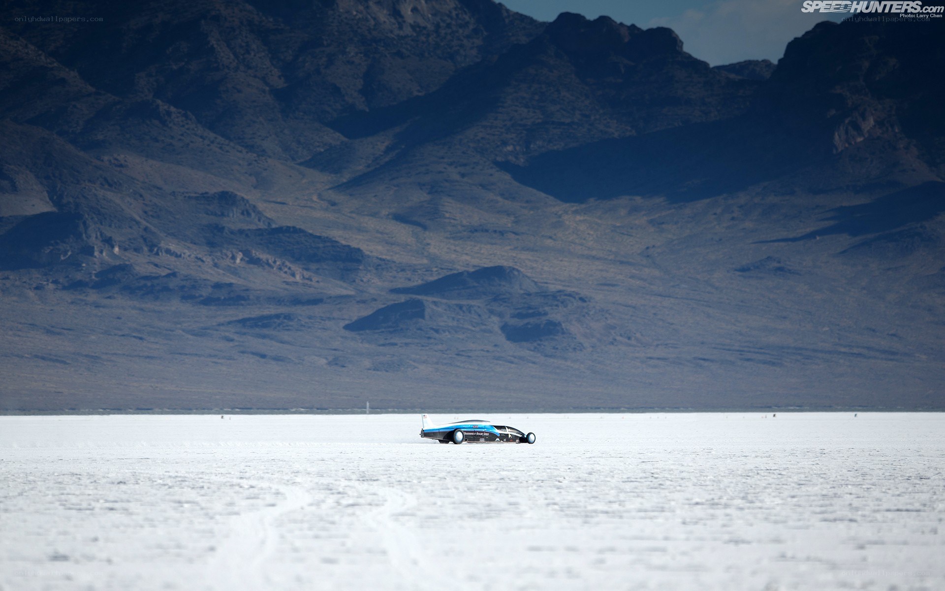 Blue car on salt flat