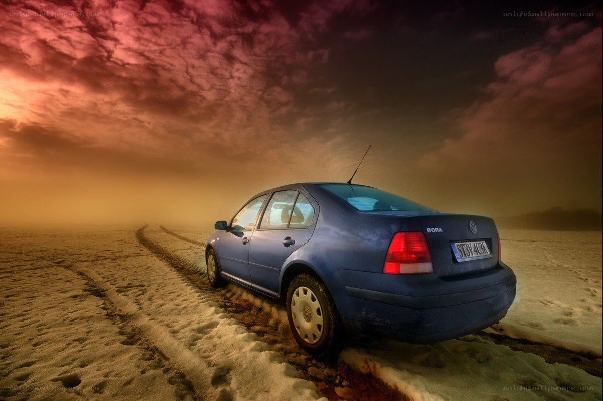 Blue car on snowy field