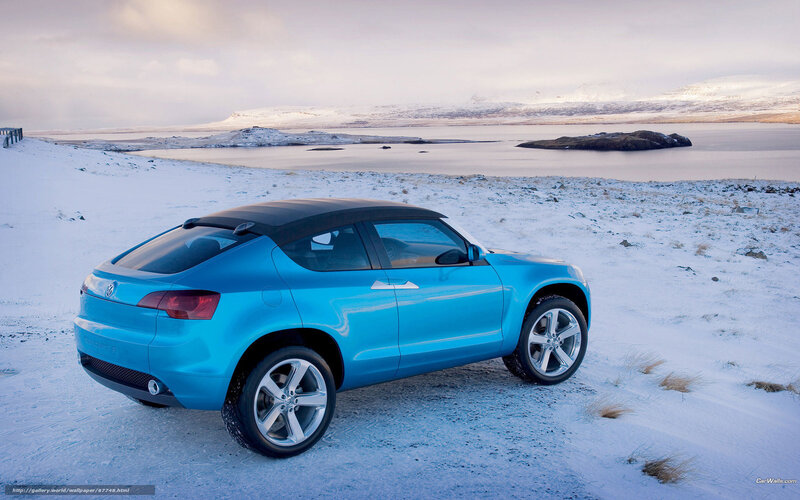 Blue car on snowy landscape