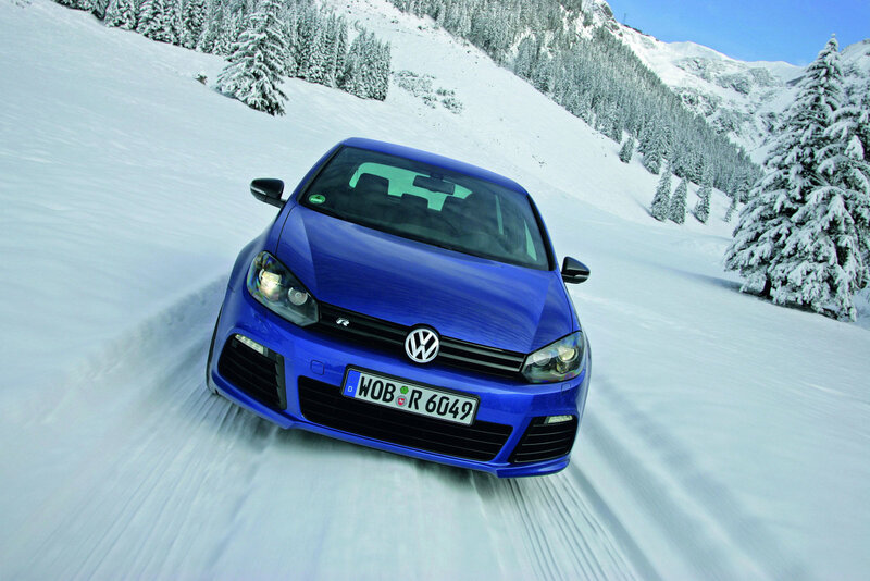 Blue car on snowy mountain