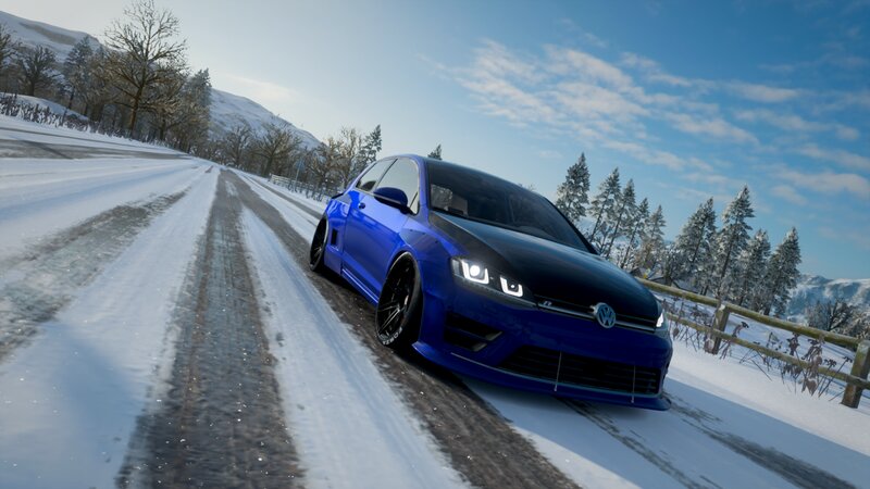 Blue Car on Snowy Road — Cold