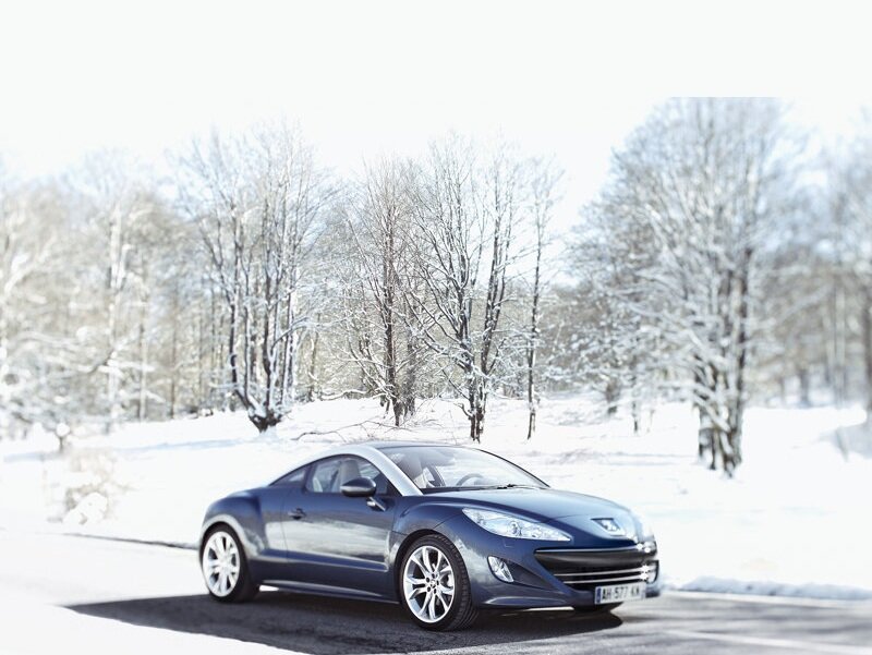 Blue Car on Snowy Road — Serene