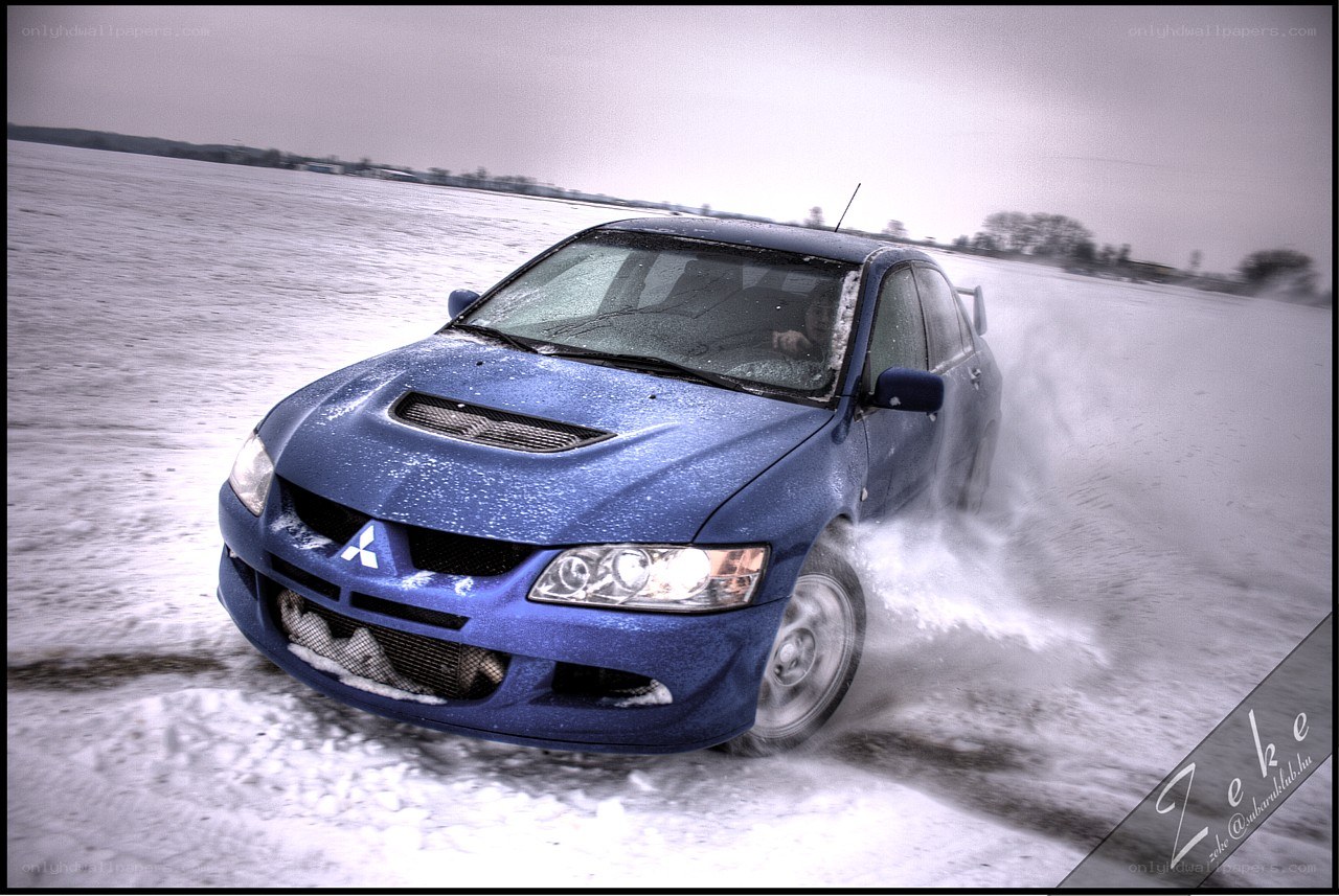 blue car on snowy road