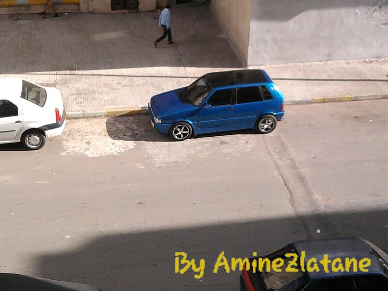 Blue Car on Street