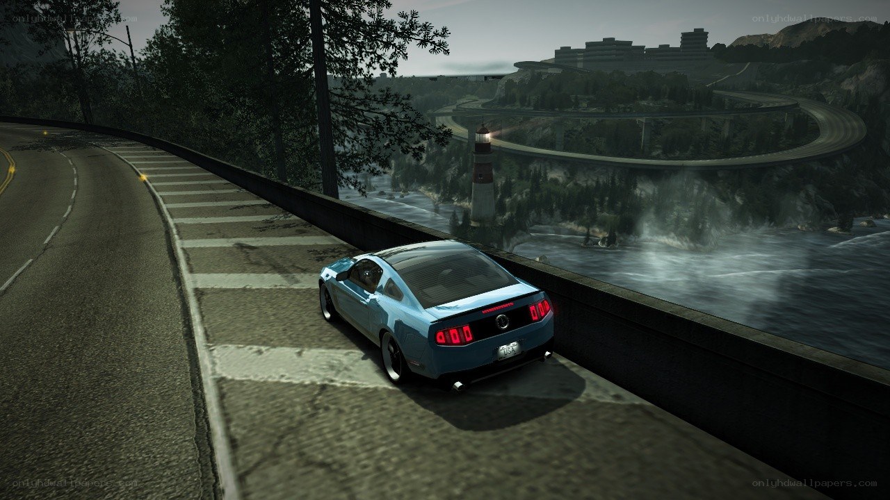 blue car on winding road