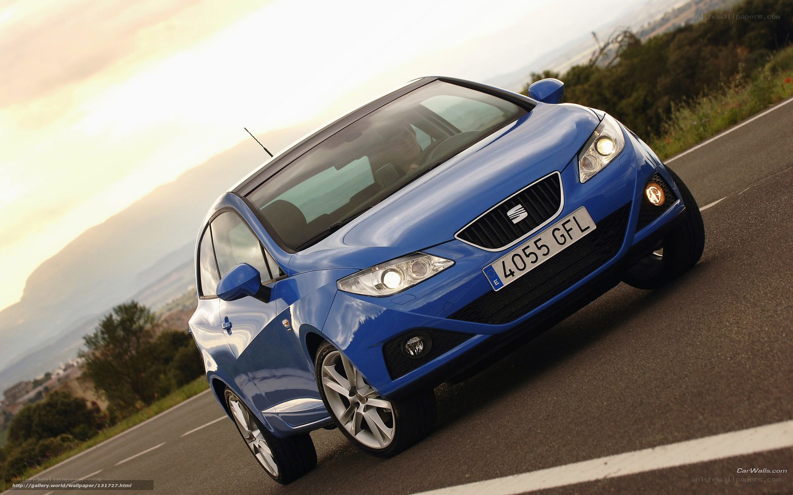 blue car on winding road