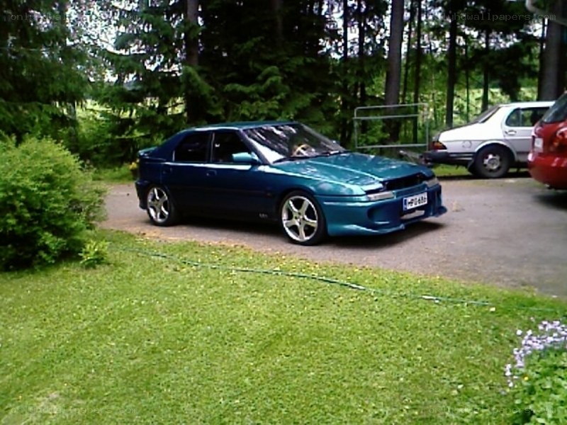 blue car parked in driveway