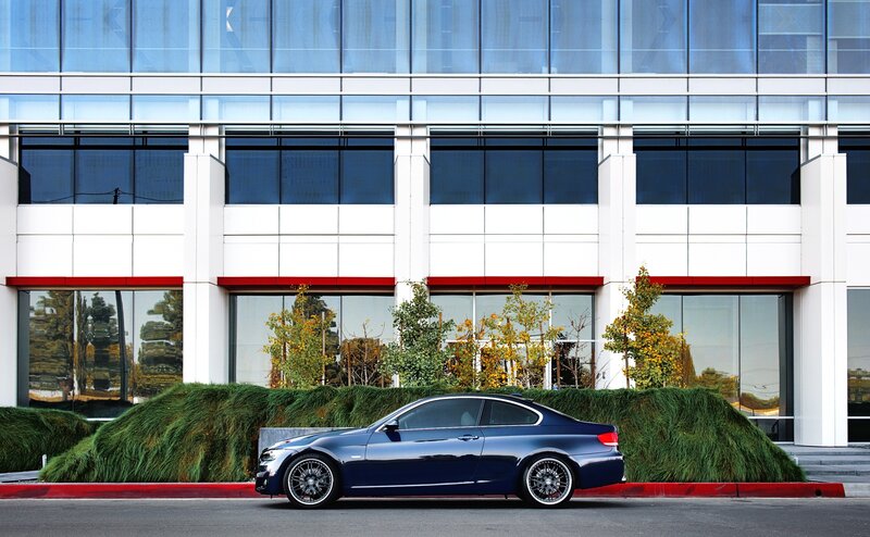 Blue car parked in front of building