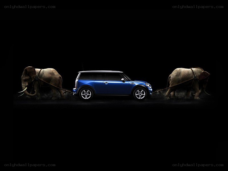 Blue car pulled by elephants