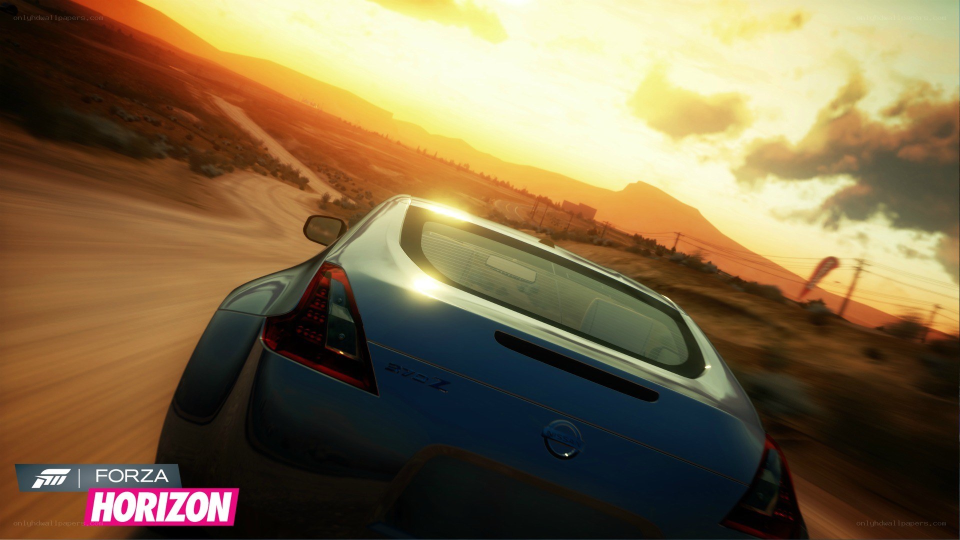 Blue car racing at sunset