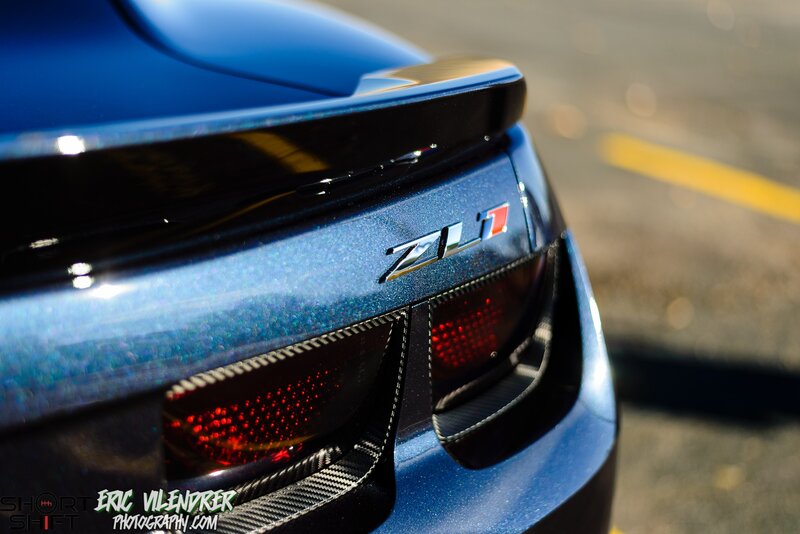 Blue Car Rear Badge — Dramatic