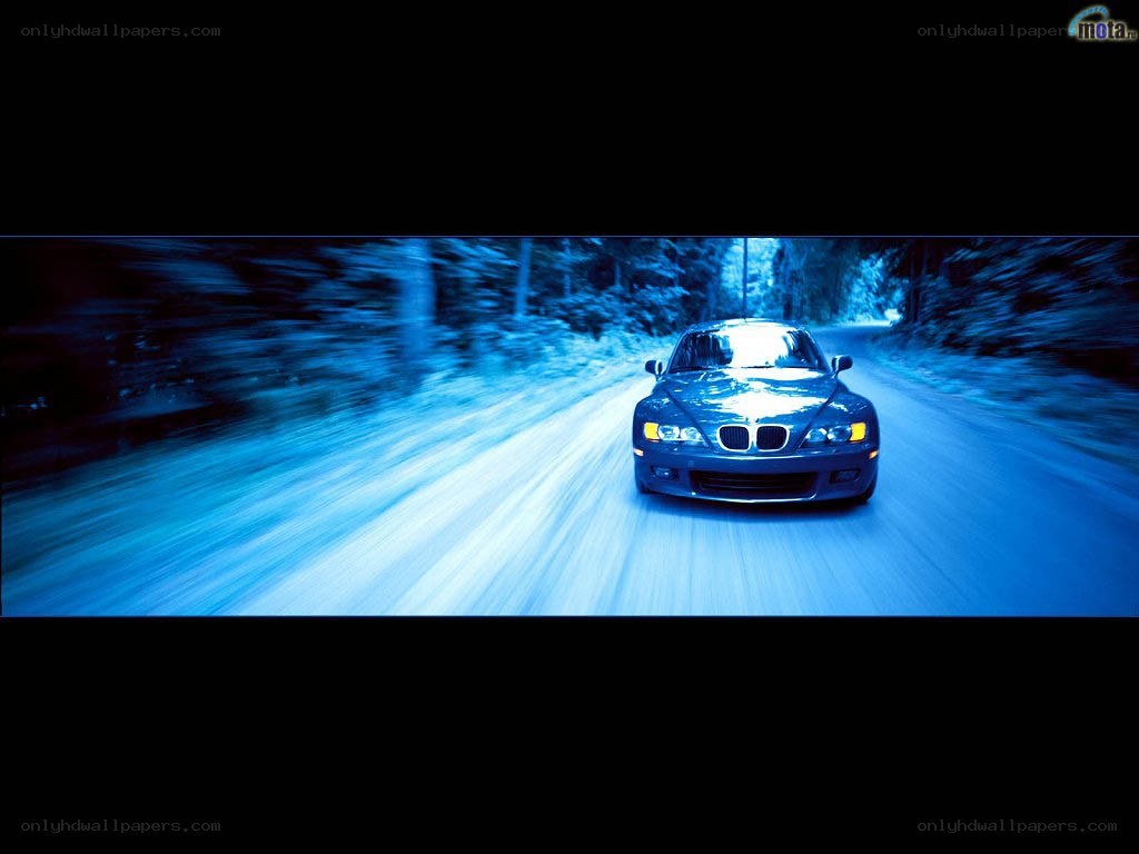 blue car speeding on road