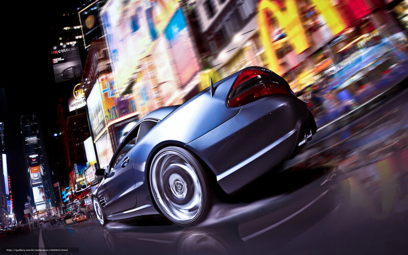 Blue car speeding through city