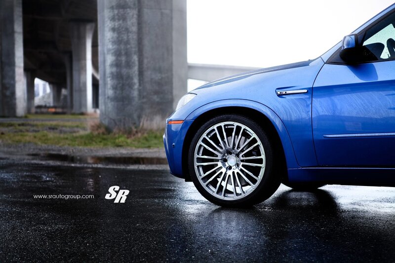 blue car under overpass