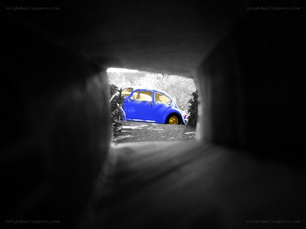 Blue car viewed through tunnel