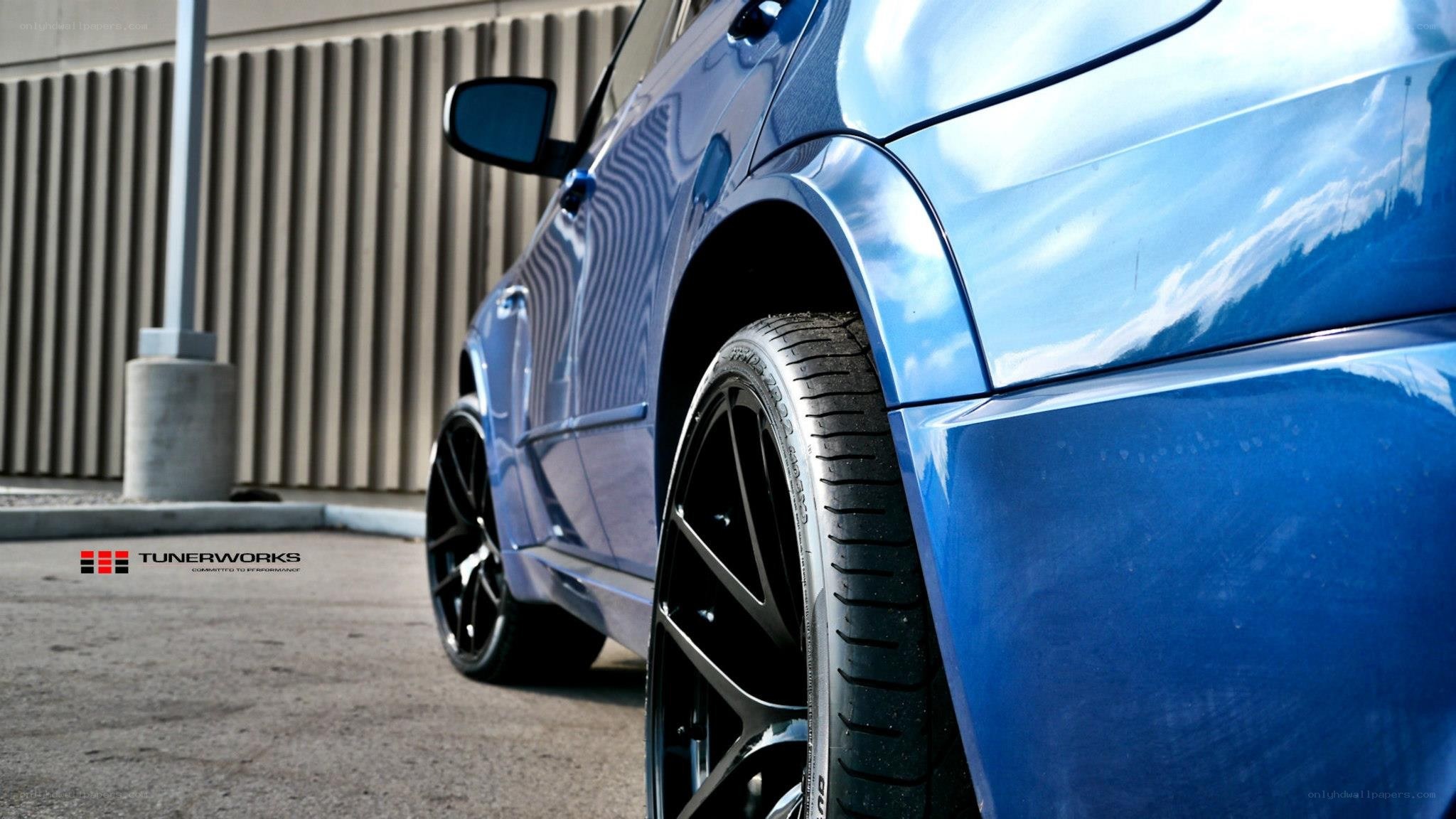 blue car with black wheels