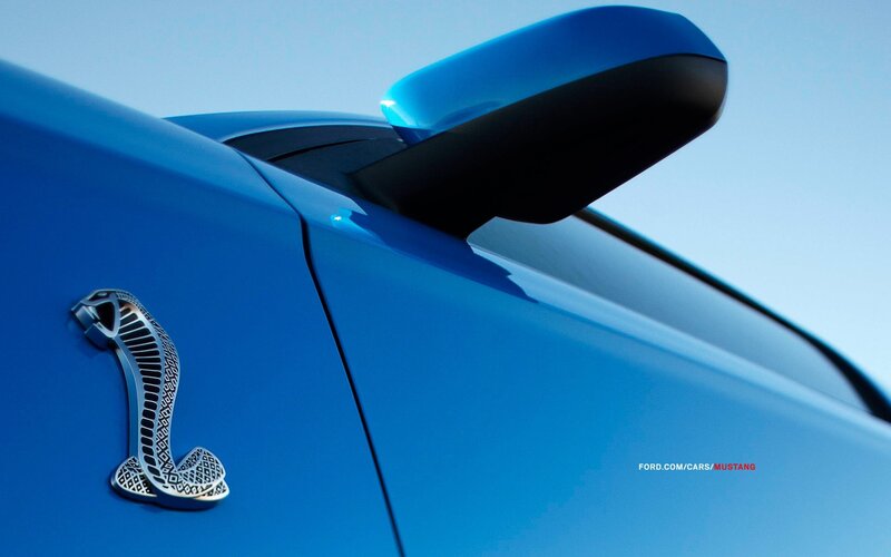 Blue Car with Cobra Emblem — Dramatic, Photograph