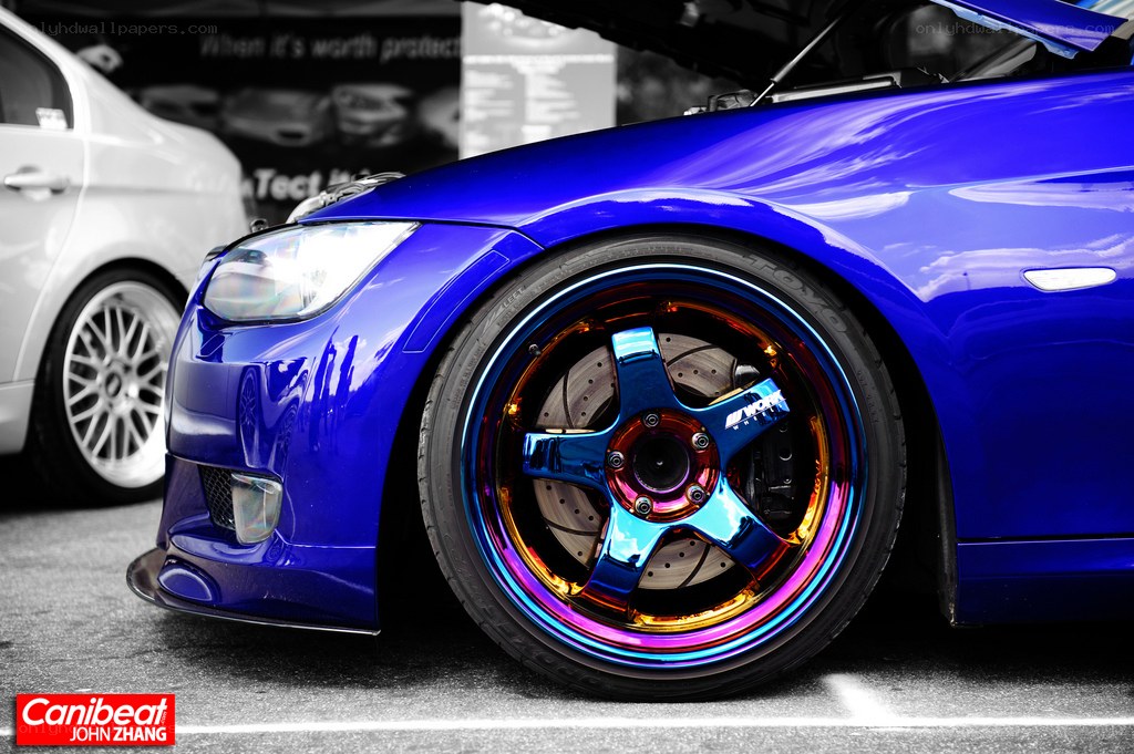blue car with custom wheels