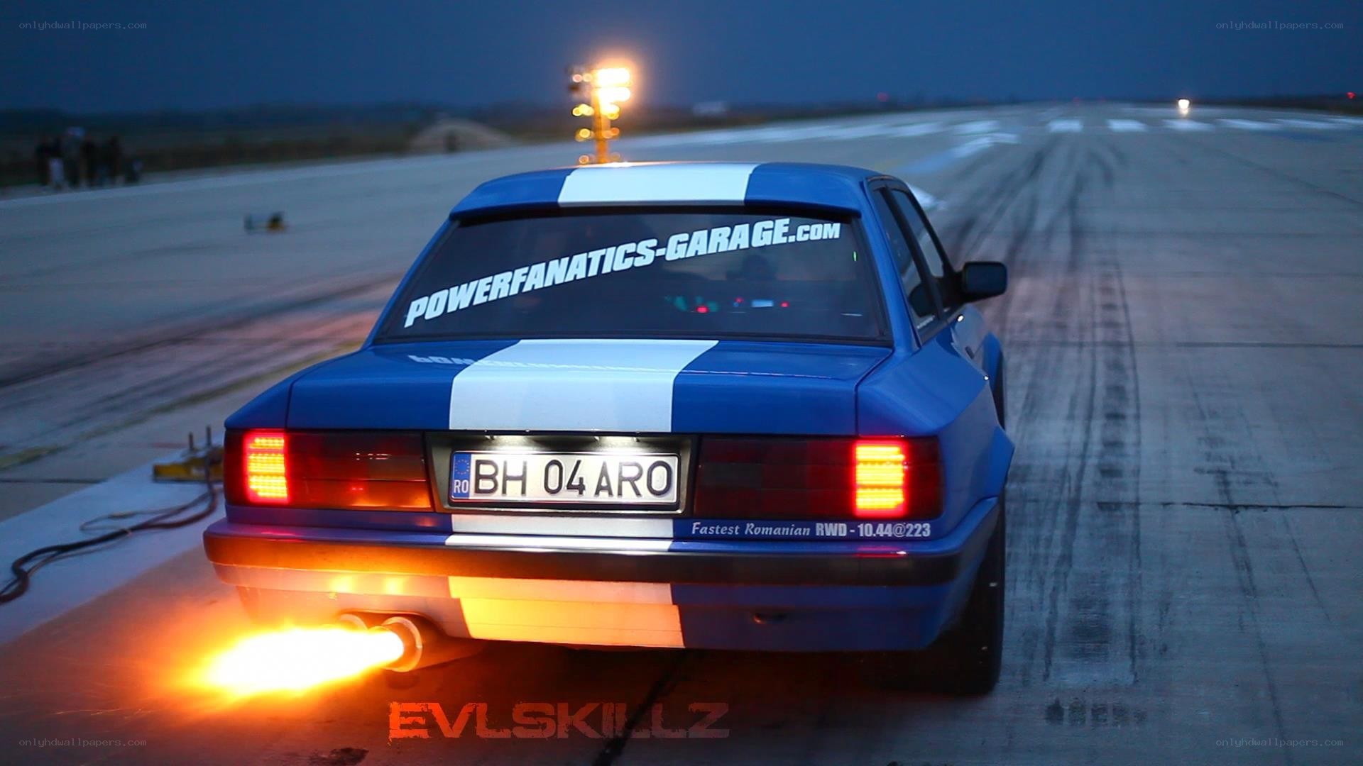 Blue car with flames on runway