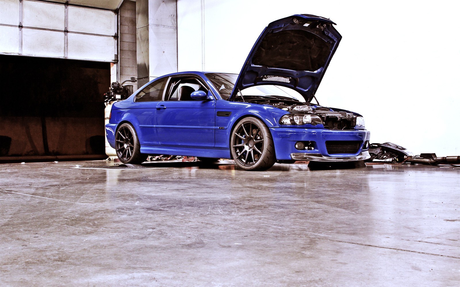 Blue car with open hood