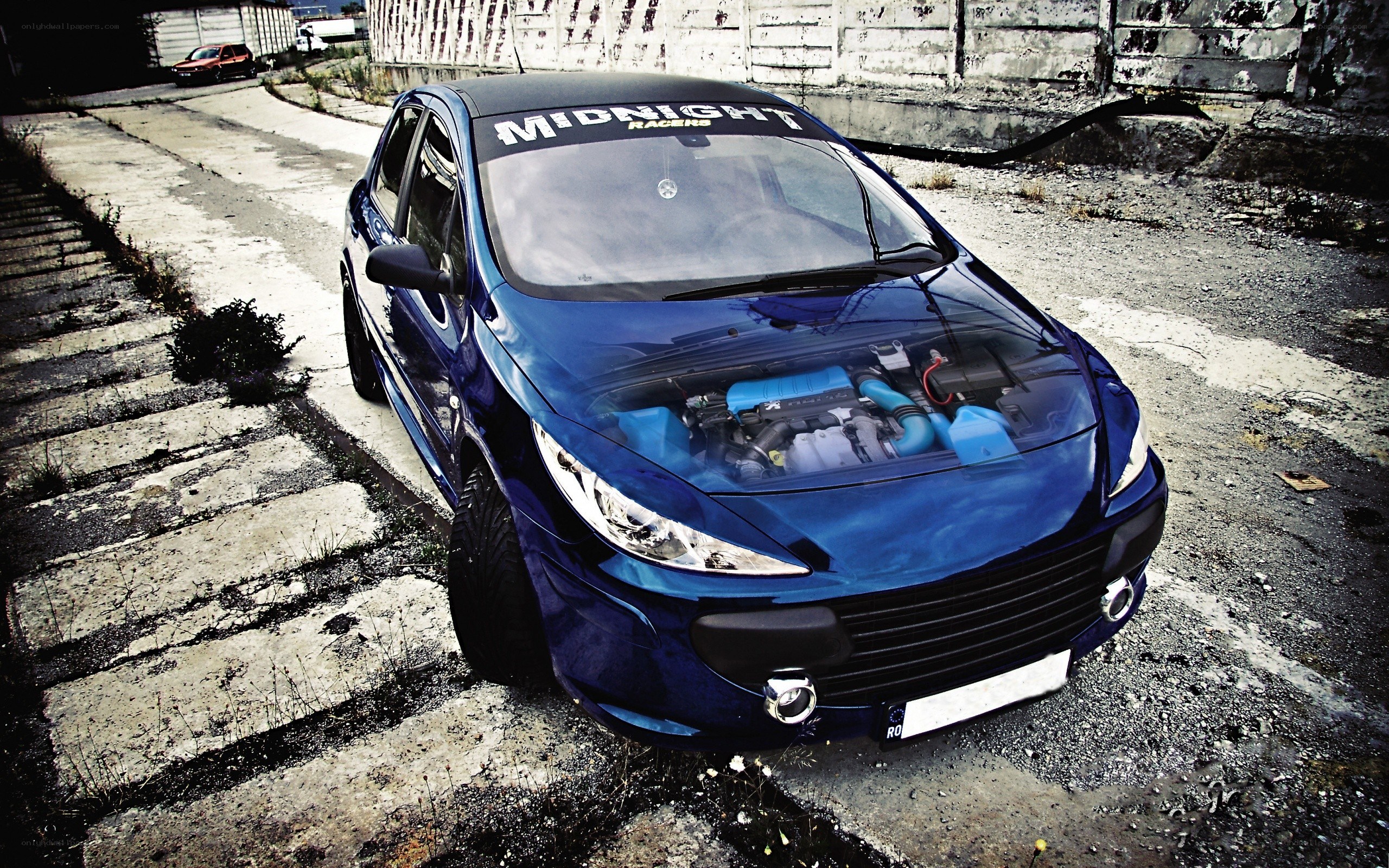 blue car with open hood