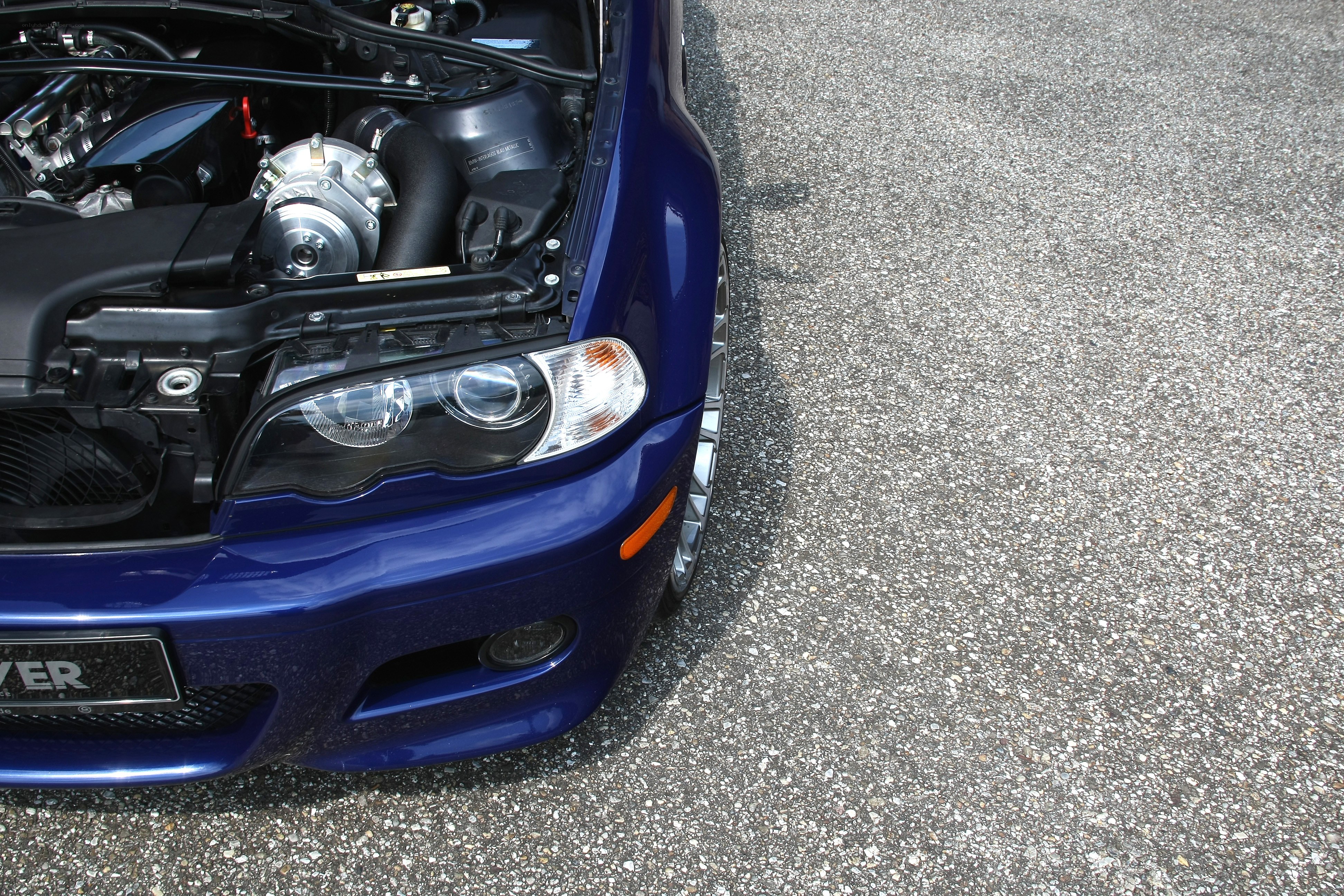 blue car with open hood