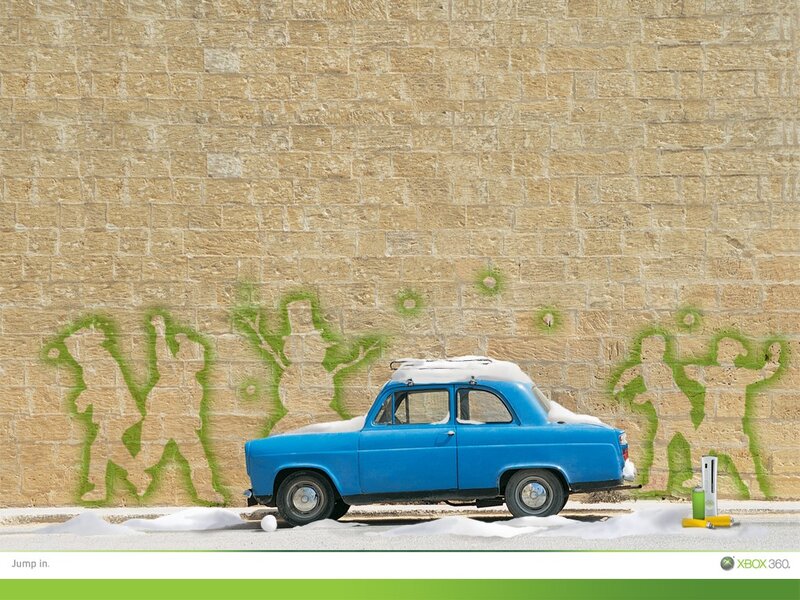 Blue car with snow and graffiti