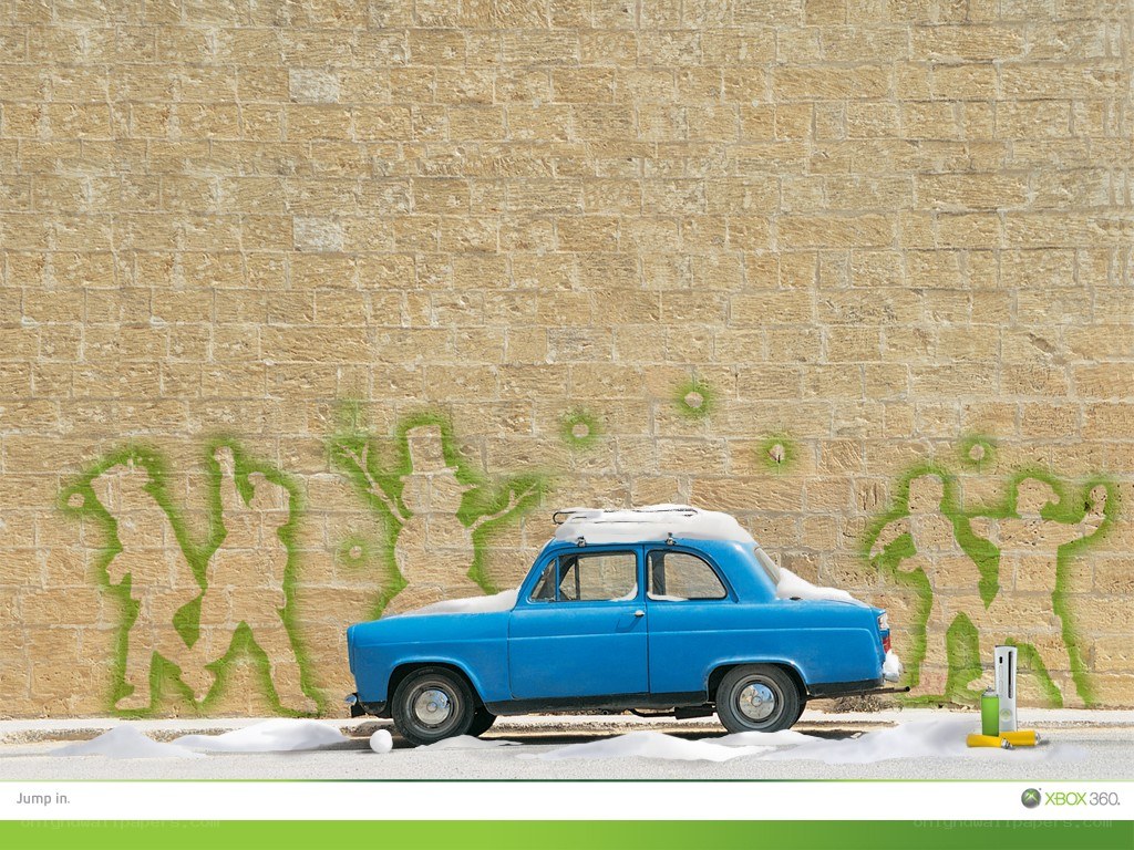 Blue car with snow and graffiti
