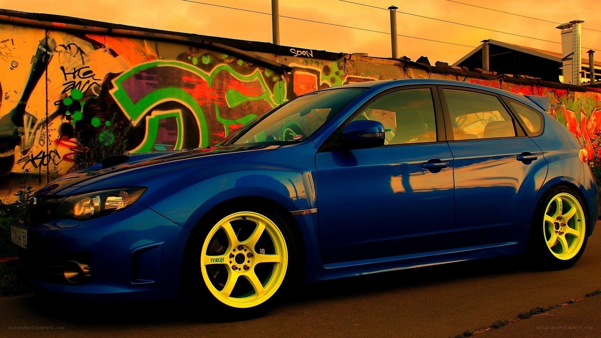 blue car with yellow wheels
