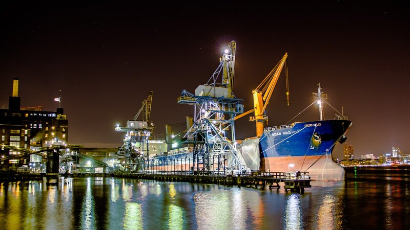 Blue Cargo Ship at Dock