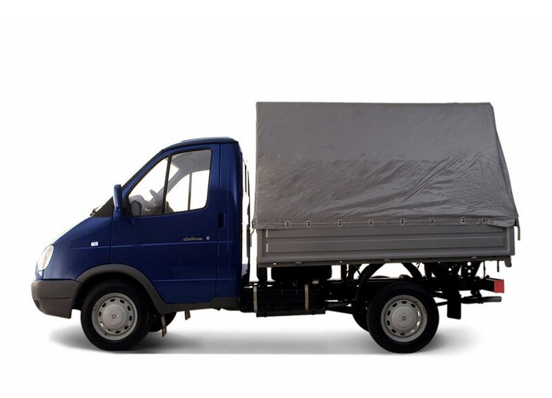 blue cargo truck with tarp