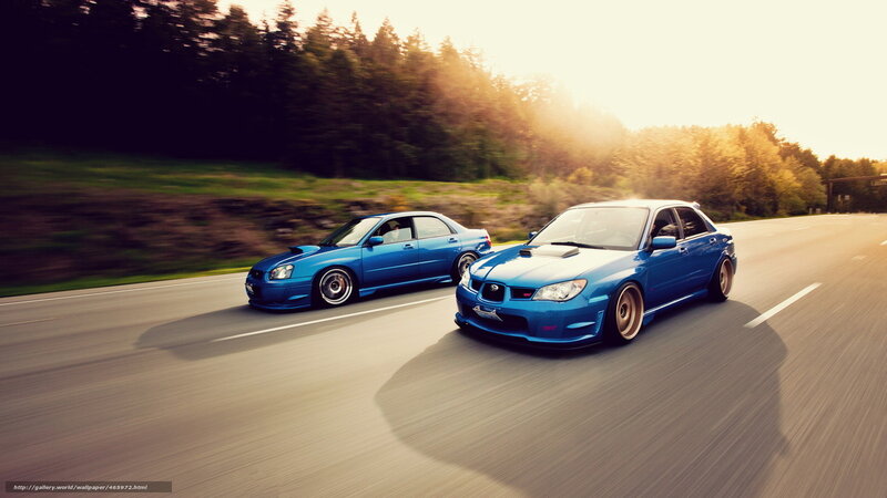 Blue cars racing on road