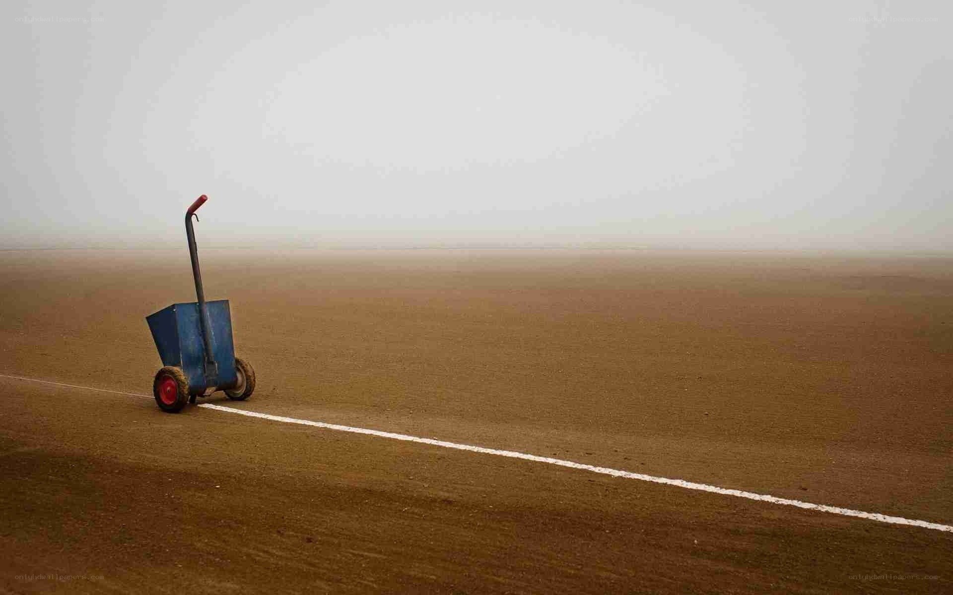 Blue cart on a dirt field