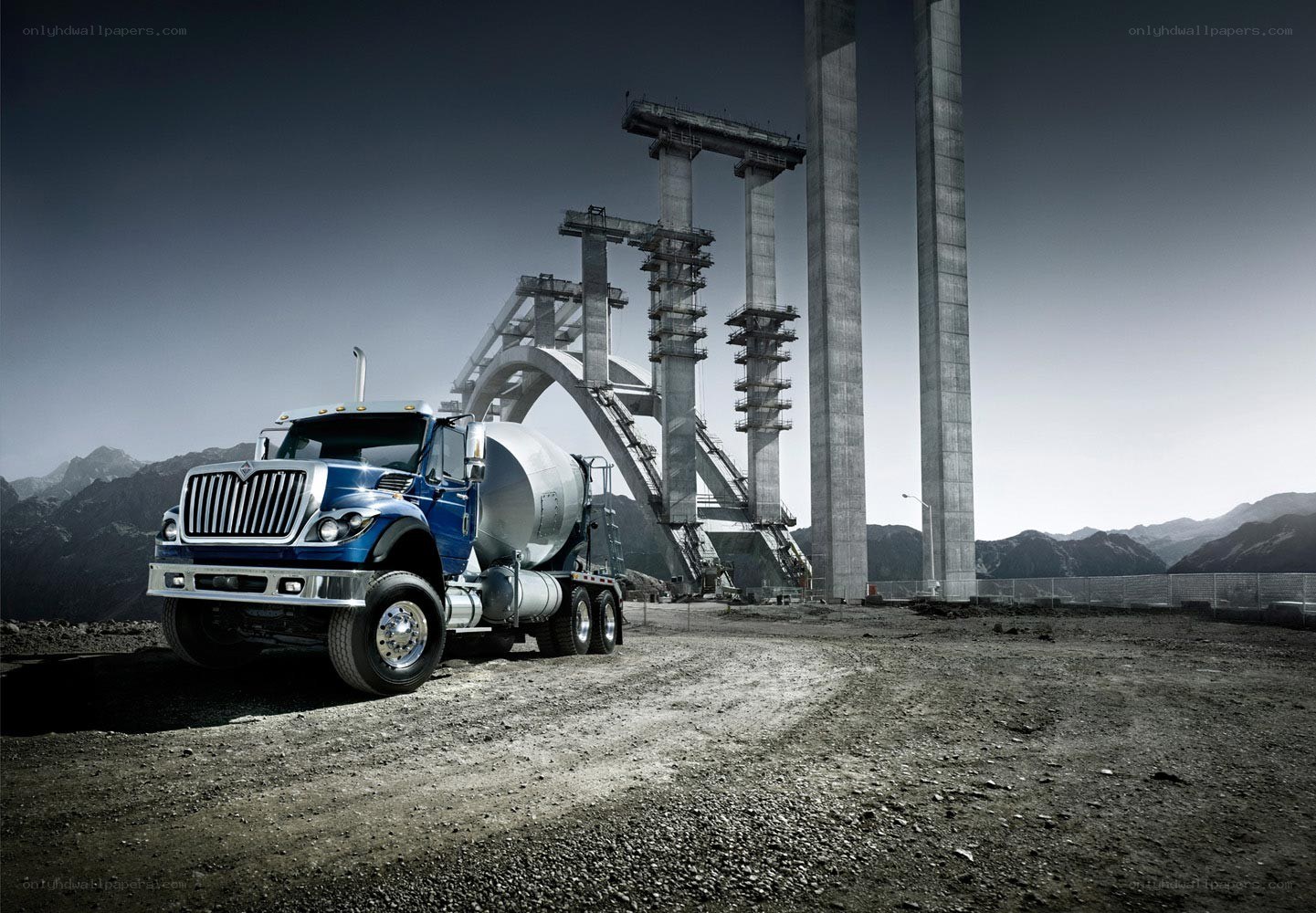 Blue cement truck at construction site