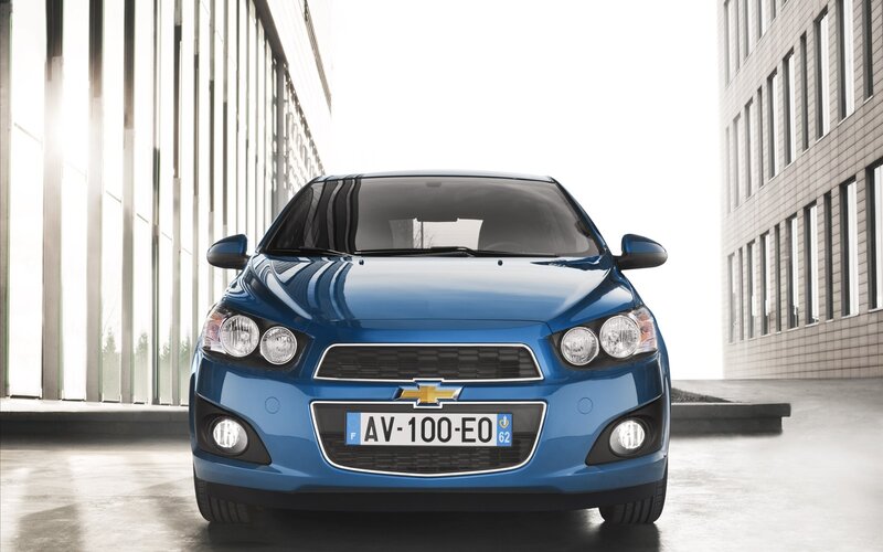 Blue Chevrolet Aveo in urban setting